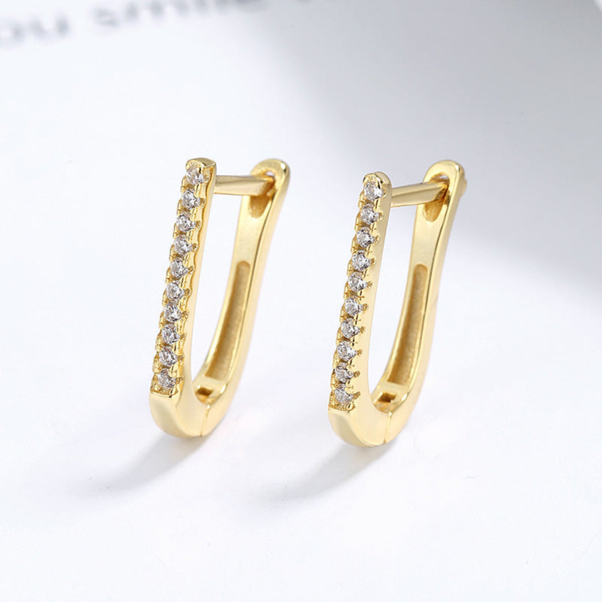 Brincos LUNA em U com zircónias em acabamento dourado