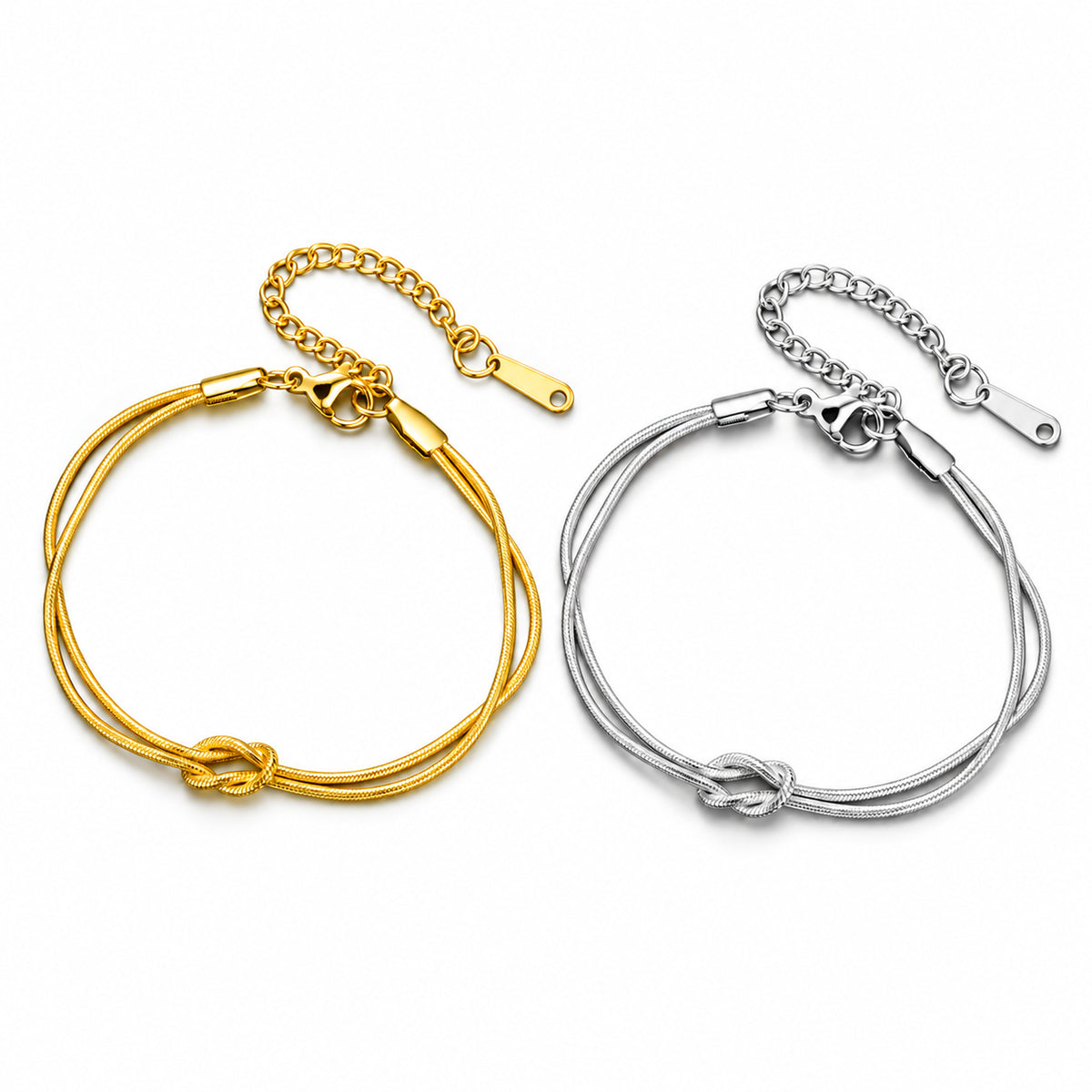 Pulseira MAIA em aço inoxidável com corrente dupla e nó central, em dourado e prateado.